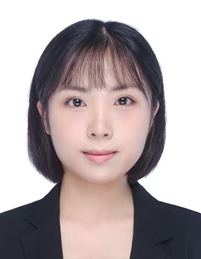 A person with short black hair Description automatically generated